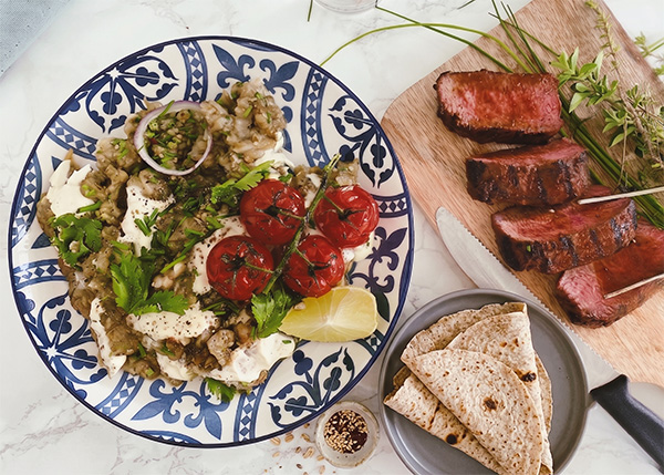 Marinated beef butcher's cut,  aubergine baba ganoush and wholegrain flat bread