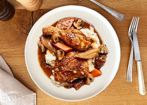 Chicken casserole “coq au vin” style, hand-crushed potatoes