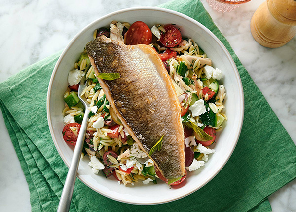 Grilled sea bass with lemon, Greek orzo salad