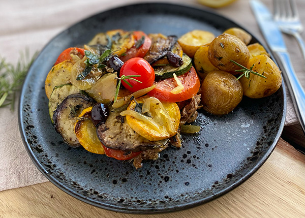 Lamb confit with vegetable Tian, onion compote, roasted baby potatoes