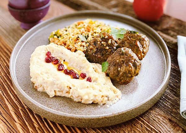 Lebanese plate with lamb and beef keftas, tabouleh and moutabal