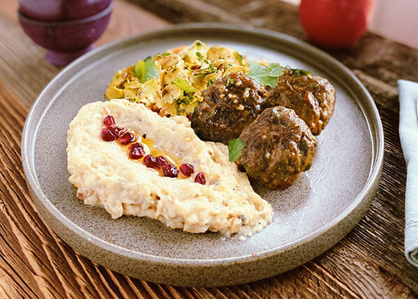 Lebanese plate with lamb and beef keftas, moutabal and cauliflower
