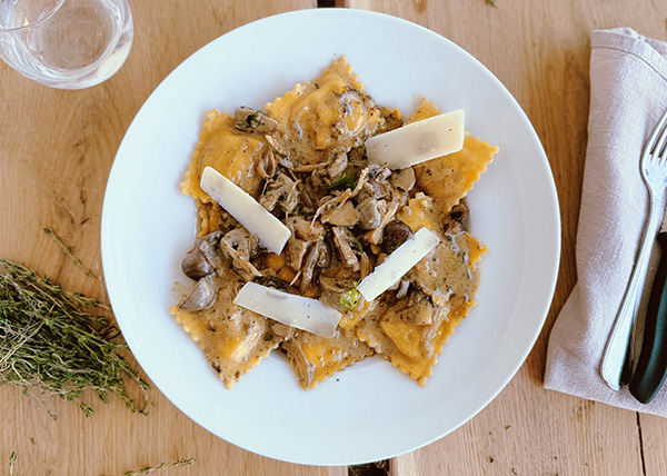Ravioli with porcini mushrooms and ricotta in a creamy Parmesan broth