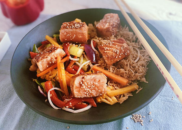 Wok vegetables, salmon teriyaki with sesame seeds and brown rice
