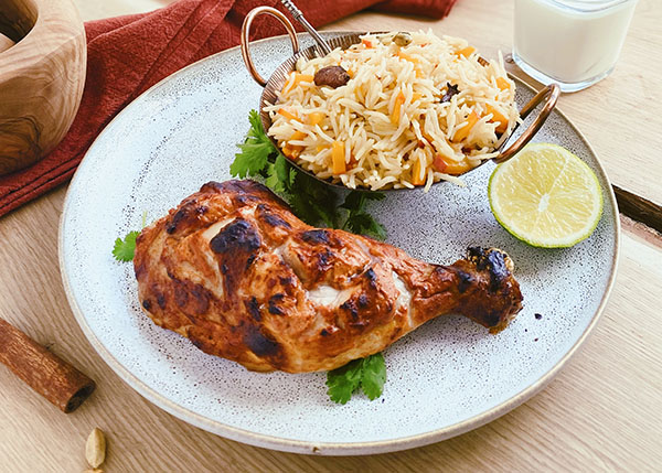 Tandoori chicken, rice and sweet pumpkin cubes