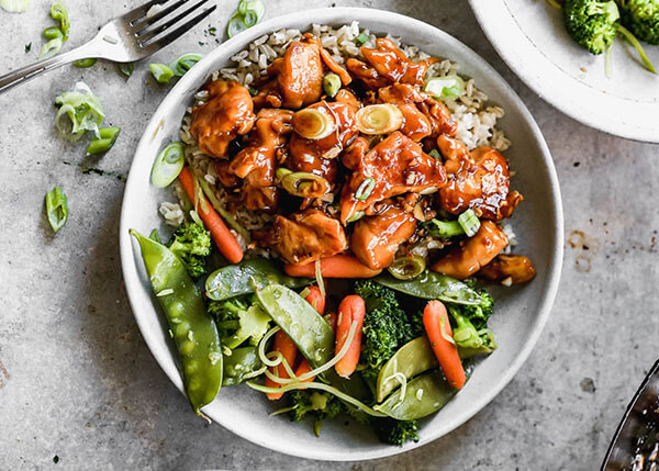 Sautéed vegetables, teriyaki chicken and sesame, rice