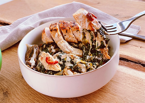 Chicken breast with lemon, creamy spinach and artichoke gratin with real Parmesan