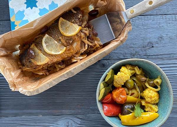 Tajine of sea bass and vegetables "Chermoula", onions and lemon confit