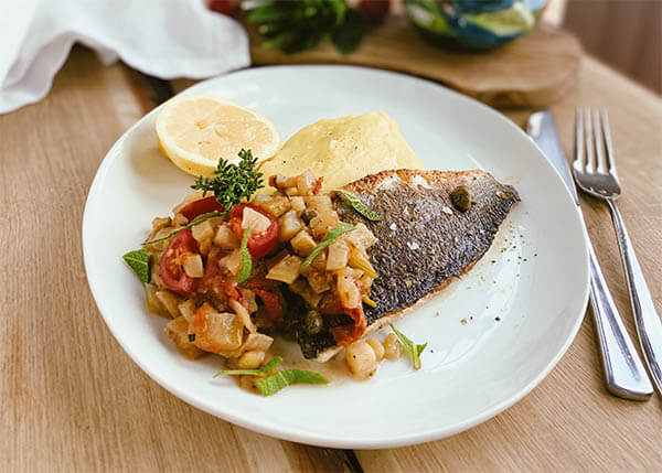 Grilled sea bass fillet with capers, fennel and tomato, potato mousseline