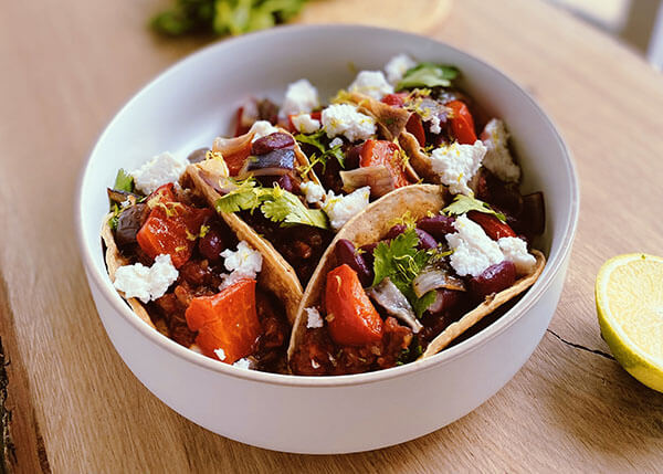 Tacos with aubergine and tomato salsa and feta cheese