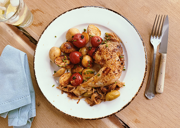 Chicken Yassa, baby potatoes and cherry tomatoes