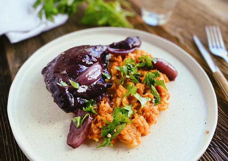 Duck leg confit with shallots, root vegetables