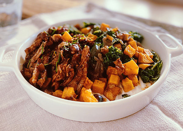 Pulled pork, sautéed butternut and kale